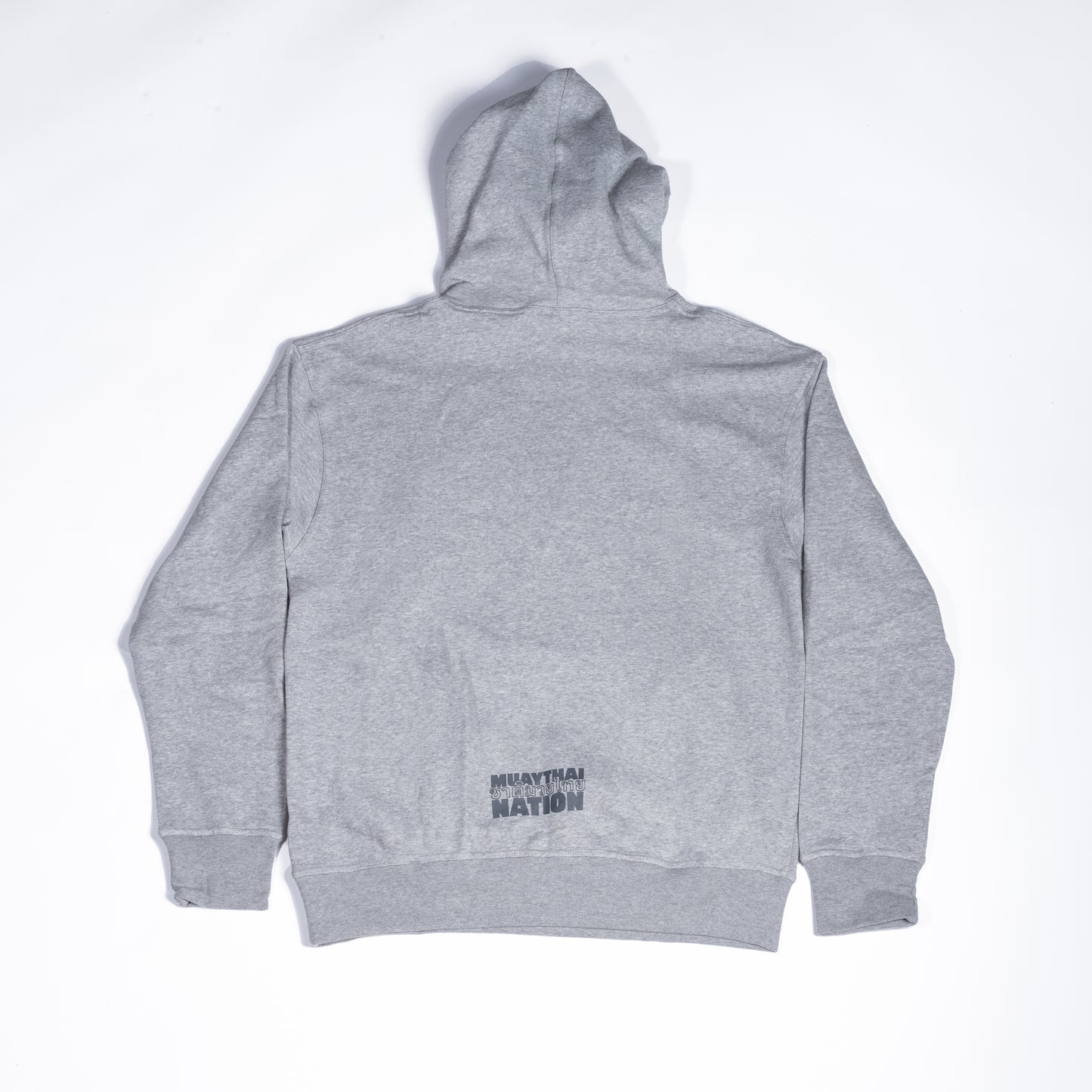 Back view of Muay Thai Nation light grey hoodie with minimal lower hem branding.