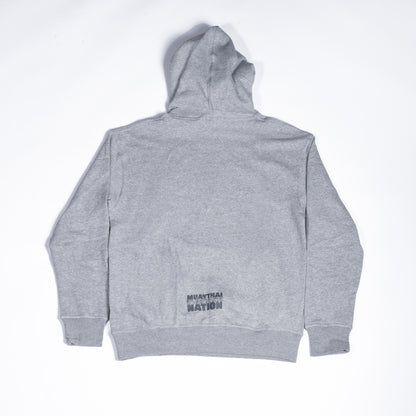Back view of Muay Thai Nation light grey hoodie with minimal lower hem branding.