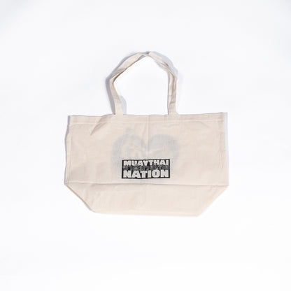 Muay Thai Nation cream-colored canvas gym tote bag showcasing a centered minimalist black block logo print