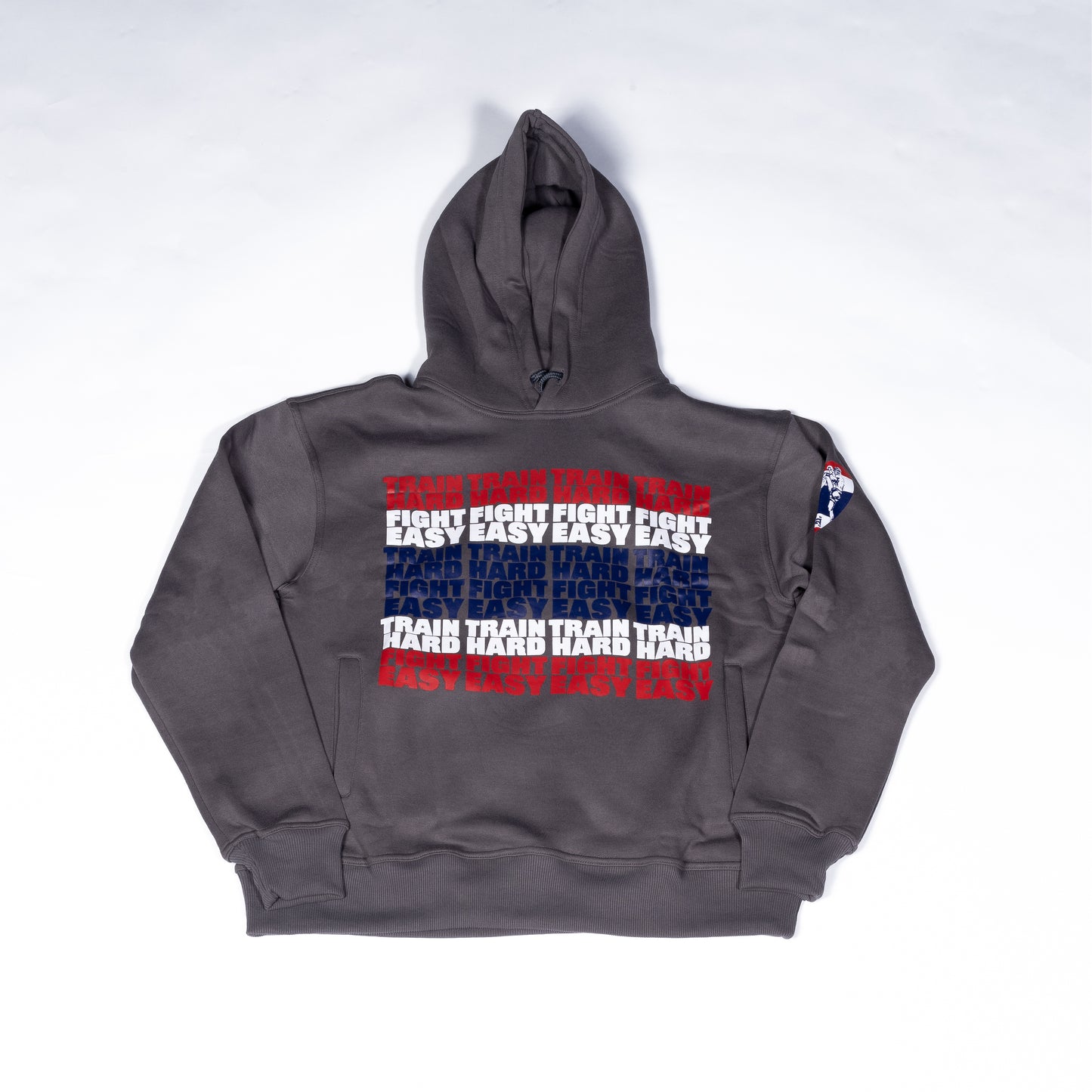 Front view of Muay Thai Nation standard dark grey hoodie with a red, white, blue striped graphic.